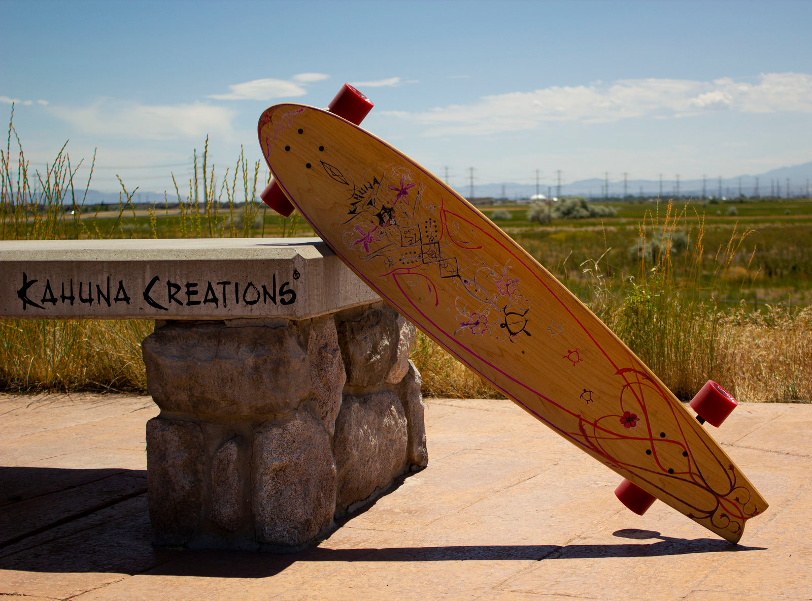 Longboard leaning against bench