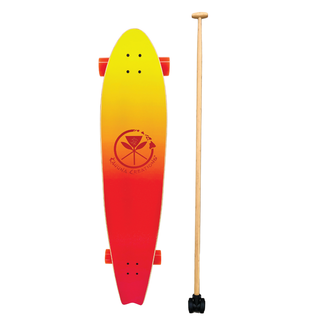 Kahuna Creations Pohaku Sunset longboard with Bamboo Big Stick land paddle