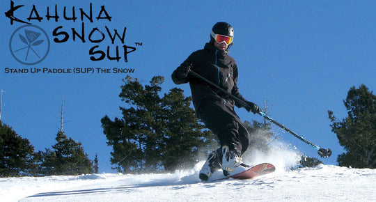 Snowboarder using the Kahuna Creations Snow Grip on a land paddle.